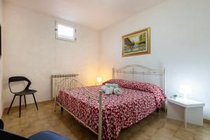 A bed or beds in a room at Casa vacanze Patrizia