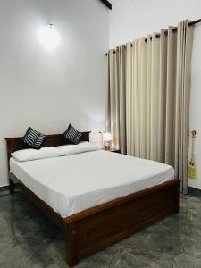 Postel nebo postele na pokoji v ubytování J&J resort