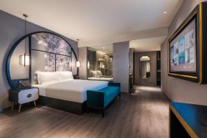 Xi 'an North Railway Station Municipal Government Orange Crystal Hotel客房内的一张或多张床位