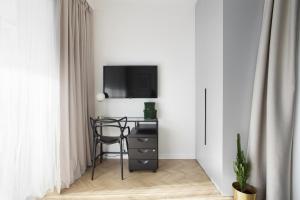 Telewizja i/lub zestaw kina domowego w obiekcie Elite Apartments Sunny