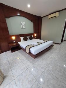 a large bedroom with a large bed in it at New Forest Patong in Patong Beach