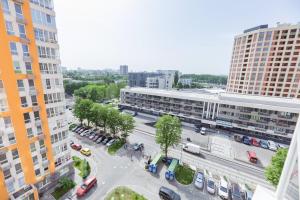 an aerial view of a parking lot in a city at 45 Kyiv Lovely Apartment in Nyvky Park in Kyiv