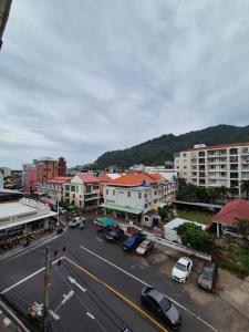 an aerial view of a city street with cars and buildings at New Forest Patong in Patong Beach
