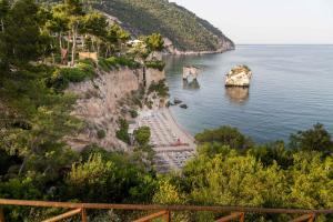 a view of a body of water from a hill at AH Premium Baia dei Faraglioni in Mattinata