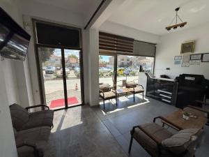 a living room with a couch and chairs and a table at FAMİLY PLAs HOME in Edirne