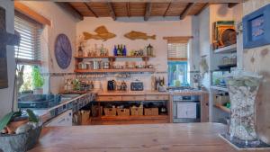 a kitchen with a counter and a sink and a counter top at Rox Villa in Rooiels +72 photos