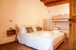 a bedroom with a bed and a bunk bed at Agriturismo Tenute Mauro in Ispica +56 photos