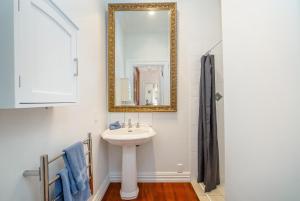 a bathroom with a sink and a mirror at Bellini in Martinborough  +25 photos