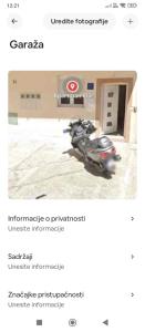 a screenshot of two motorcycles parked in a room at Apartment Ella in Split