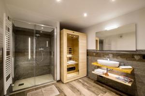 a bathroom with a sink and a shower at Fenat - Alpine Living in Introd