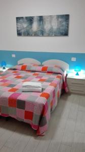 מיטה או מיטות בחדר ב-Residence La Madonnina