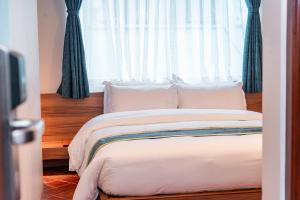 Letto o letti in una camera di Harsha Boutique Hotel