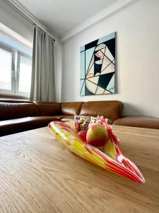 a tray of fruit on a table in a living room at CARLA comfort stay with 2 bathrooms in Košice