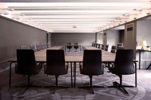 a conference room with a long table and chairs at Scandic Palace Hotel in Copenhagen