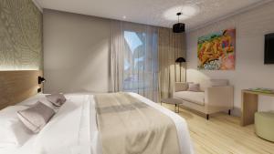 Postel nebo postele na pokoji v ubytování Reva Hotel TAHITI