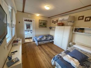 a small room with two beds in a room at Baita Chalet del Colle in Corsanico-Bargecchia +92 photos