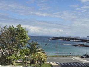 a view of a body of water with boats in it at Winahost Salvora en Primera Línea de Mar in Ribeira