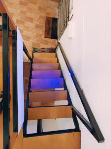 a set of stairs with colorful paint on them at KODAI RiYA FRAME CASTLE in Kodaikānāl