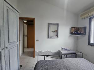 Ένα ή περισσότερα κρεβάτια σε δωμάτιο στο Ca' da Ste by Holiday World