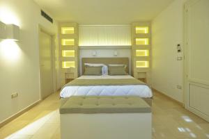 Postel nebo postele na pokoji v ubytování Montiro' Hotel
