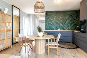 a dining room with a table and chairs at MEREKARP Living in Tallinn +21 photos