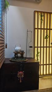 a wooden dresser with a pot on top of it at 종로 동대문 3룸 아파트 in Seoul