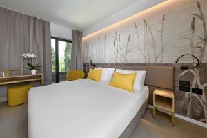 Postel nebo postele na pokoji v ubytování Hotel Royal Village