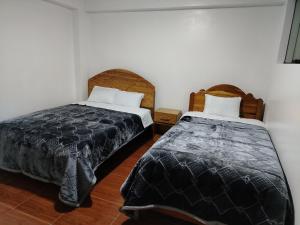 Postel nebo postele na pokoji v ubytování PATAWASI Guest House Cusco