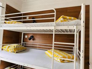 Μία ή περισσότερες κουκέτες σε δωμάτιο στο Samps Hostel