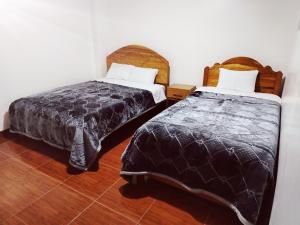 Postel nebo postele na pokoji v ubytování PATAWASI Guest House Cusco