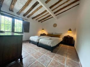 Ένα ή περισσότερα κρεβάτια σε δωμάτιο στο Casa Rural Palaz Cinco +27 φωτογραφίες