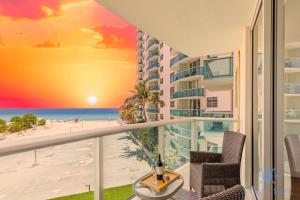 a balcony with a view of the beach and the ocean at Tides beautiful ocean view condo-promotions in Hollywood