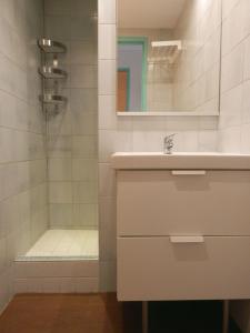 a bathroom with a sink and a shower at Les Cigalous in Salavas +64 photos