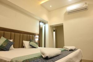 Postel nebo postele na pokoji v ubytování Manan Homestay