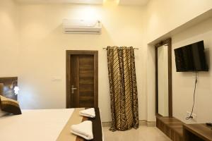 TV a/nebo společenská místnost v ubytování Manan Homestay