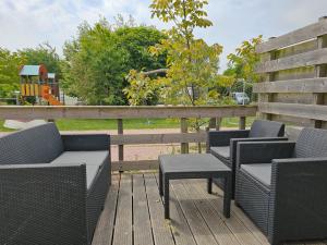 Χώρος καθιστικού στο Chalet OK29 Oostkapelle +6 φωτογραφίες