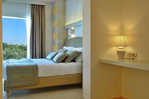 Postel nebo postele na pokoji v ubytování Montiro' Hotel
