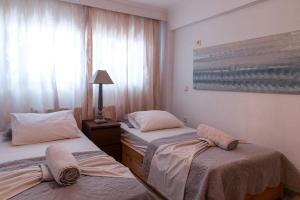 Ένα ή περισσότερα κρεβάτια σε δωμάτιο στο Silot apartment 2 +3 φωτογραφίες