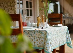 a table with a blue and white table cloth at Punjab Village Farm near Amritsar in Gurdāspur