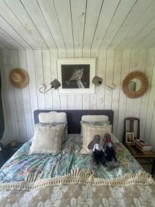 two stuffed animals sitting on a bed in a room at Kurkse KUUR in Kurkse