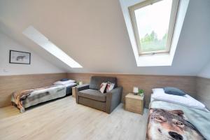 Łóżko lub łóżka w pokoju w obiekcie Ekskluzywny Apartament Sun Seasons 24 w Karpaczu by Noclegi Renters