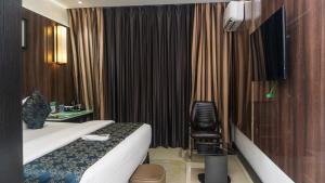 Televisyen dan/atau pusat hiburan di GreenPoint Hotel