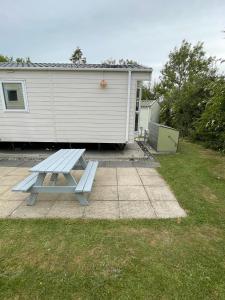 a picnic table in a yard next to a house at Bowland Fell Retreat in Tosside +45 photos
