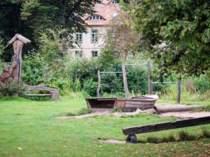 a garden with a tub in the middle of a field at Biohof Medewege in Schwerin