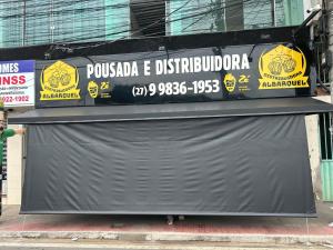 a sign on the side of a building at Pousada albarquel in Serra