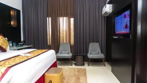 Televisyen dan/atau pusat hiburan di GreenPoint Hotel