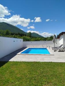 a swimming pool in the backyard of a house at Kuća za odmor Noah in Bihać
