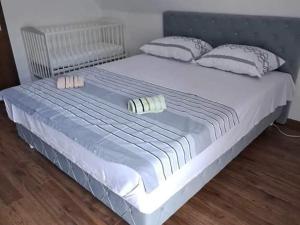 a large white bed with two pillows on it at Kuća za odmor Noah in Bihać