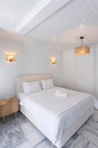 Ένα ή περισσότερα κρεβάτια σε δωμάτιο στο Mimoza's House Spetses