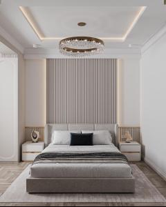 a bedroom with a large bed and a chandelier at Apartment in Muruntau